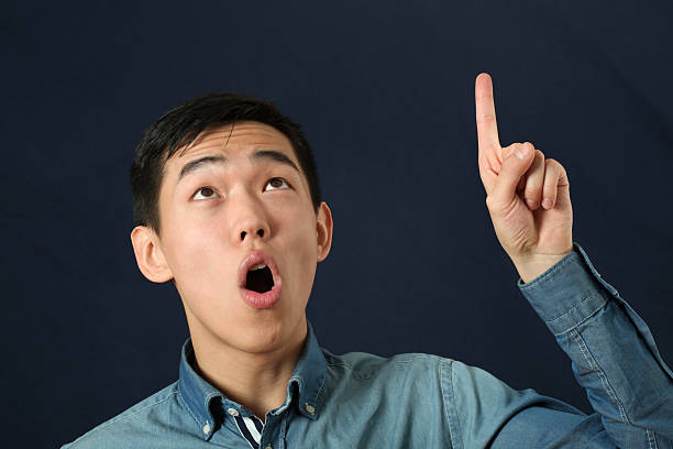 https://media.gettyimages.com/photos/funny-young-asian-man-pointing-his-index-finger-upward-picture-id469867870?k=6&m=469867870&s=612x612&w=0&h=H-JhR_UEuyiak9KCTLx2YKgf0ctGQ4D_fzExQLJjPz4=#.jpg